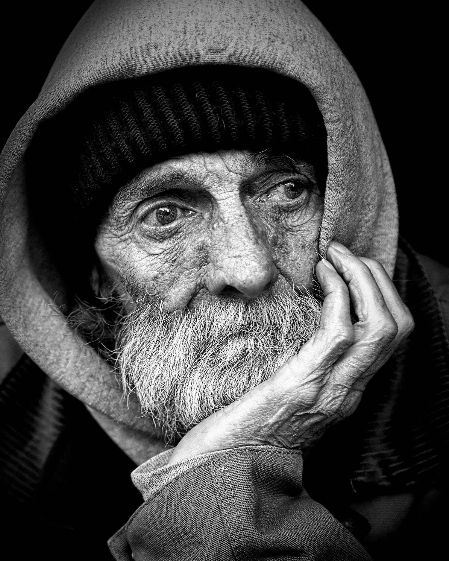 Photo found in Pexels, from Pixabay. An old man portrait in black and white
